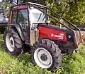 Valmet 6400 with a forestry roll cage
