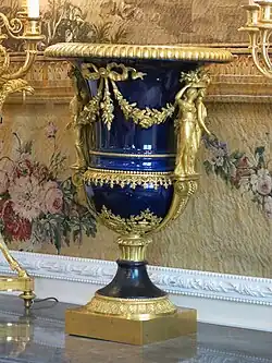 Louis XVI style caryatids on the Médicis Vase, by Louis-Simon Boizot, Pierre Philippe-Thomire and the Sèvres Porcelain Manufactory, c.1787, porcelain and gilded bronze, Louvre[28]