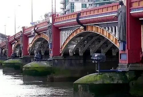 Image 46Vauxhall Bridge across the River Thames opened in 1906 and features sculptures by F. W. Pomeroy.