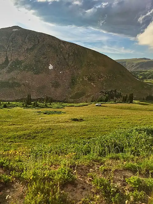 Illegal off-roading of a vehicle on Rollins Pass near Mount Epworth and Deadman's Lake. The alpine tundra is extremely fragile and can take 100–500 years to fully recover.[230][231]