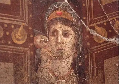 In this painting, Cleopatra, depicted as Venus, wears a diadem.