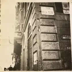 The photo shows the temporary plaque with the new street name affixed to Palazzo Doria Pamphilj