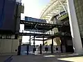 Gates now dwarfed between and beneath the south and east stands