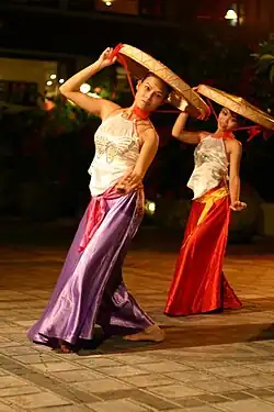 Two dancers wearing yếm