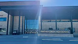 View of the exterior in front of Panther Creek High School in Frisco, Texas