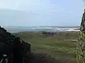 View from the entrance, surf in Cymyran Bay
