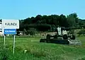 Entering the village of Kalinov (WWII liberation memorial with displayed artillery piece)
