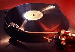 Image 17An LP record on a phonograph (from Album era)