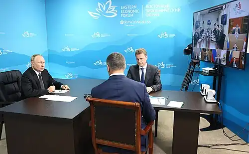 2022 Forum: President of Russia Vladimir Putin (left) virtually attending the forum
