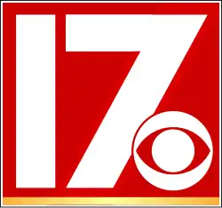 A red square with a gold underline. Inside the square are the white number 17 in a sans serif font. The CBS eye in white with a red outline partially covers the 7.