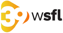 A white 39 on a yellow-orange rounded triangle, next to the black letters "W S F L" in lowercase in a sans serif with the S F L bolded.
