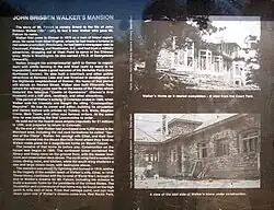 Interpretive sign with a description of Walker Castle and pictures of the house nearing completion