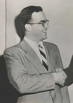 A black and white photograph of a man