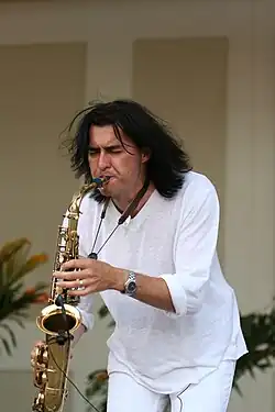 Musician Warren Hill playing a saxophone.