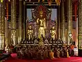 Monks chanting inside the wihan
