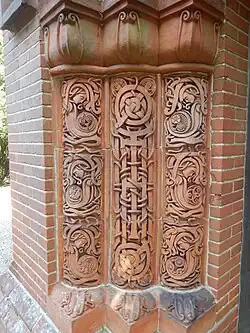 Art Nouveau interlaces on the shafts of the entrance portal columns of the Watts Cemetery Chapel, village cemetery of Compton, Guildford, England, inspired by Insular art, by Mary Fraser Tytler and George Redmayne, 1898