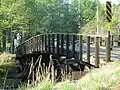 A wooden bridge crossing the railroad in eastern Waverly