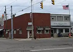 Red brick building is now an art gallery named The Nest. The lighter brick building is the post office