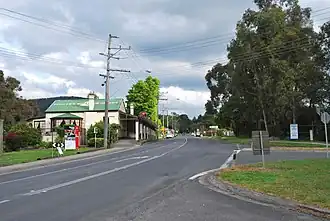 The Warburton Highway passing through Wesburn on its way to Melbourne. The Sam Knott Hotel can be seen to the left.