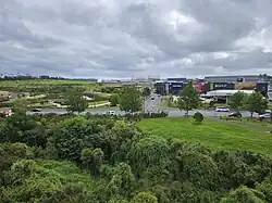 Commercial buildings and Kopupaka Reserve in Westgate