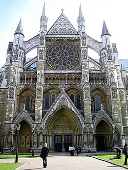 The North portal (13th-14th century) with a French style triple portal and ornate rose window.