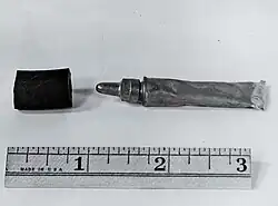 Who, Me? was a tube of rancid-smelling odorant created by R&A officer Ernest Crocker, designed to simulate the smell of a human fart. They were intended to be placed on the enemy to lower their morale.