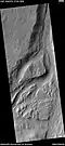 Streamlined feature in the Mangala Valles, as seen by HiRISE under the HiWish program. Many dark slope streaks are visible. Location is Memnonia quadrangle.