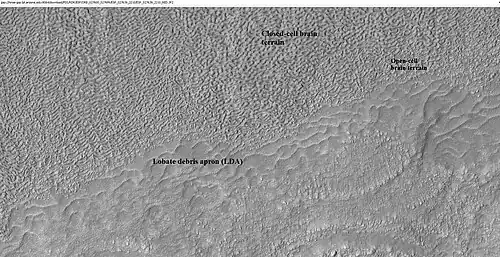 Close-up of lobate debris apron from the previous CTX image of a mesa. Image shows open-cell brain terrain and closed-cell brain terrain, which is more common. Open-cell brain terrain is thought to hold a core of ice. Image is from HiRISE under HiWish program.
