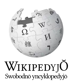 Wikipedia logo displaying the name "Wikipedia" and its slogan: "The Free Encyclopedia" below it, in Silesian