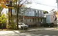 220-22 Division Street (about 1875), frame row houses and small church.