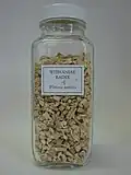 Druggist's jar containing dried roots of Withania somnifera