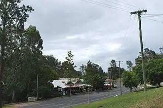 The main street of Woolooga, showing the general store, with the pub and community hall around the bend.