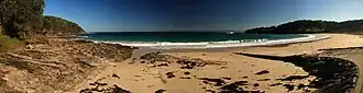 Panorama of Wreck Bay, with the village on the far right