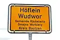 Bilingual road sign for Höflein/Wudwor