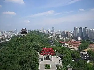 View to the east from the Yellow Crane Tower. Snake Hill is in the middle and the red-brick compound of the Wuchang Uprising memorial is to the right