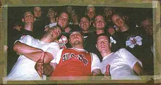 Members of xDisciplex A.D. standing amongst a crowd of other individuals in 2001.