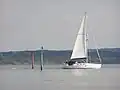 A yacht entering the river from the Solent