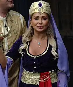 Evcimik during a theater play in 2017