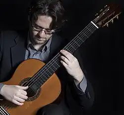 Yuri Liberzon playing classical guitar