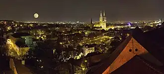Zagreb at night, with a wide street and several tall buildings