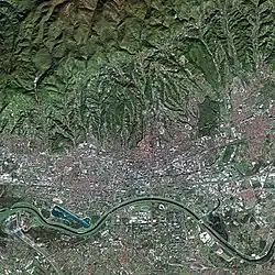 Satellite picture of Zagreb. Peščenica is on the northern side of River Sava, resembling a large whitish rectangular patch, northwards from the big white object next to the river.