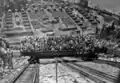 Tourists on inclined railway, Reflector Bar visible in back (1930)