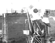 Korean naval officers raising a flag on the ship Pak Tu San at the Brooklyn Navy Yard, 1949