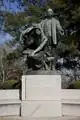 Lifting the Veil of Ignorance, a statue of Booker T. Washington that was designed by sculptor Charles Keck and unveiled on April 5, 1922. The statue depicts Dr. Washington lifting the veil of ignorance off his people, who had once been enslaved, by showing them the ways of a better life through education and skills.