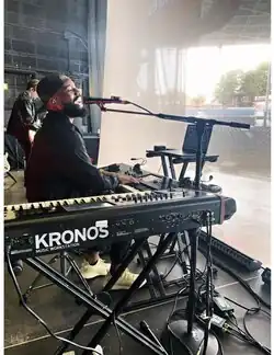 Burnett in soundcheck for Daniel Caesar live at the Budweiser Stage, 2019. Toronto, ON
