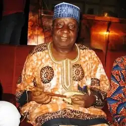 Adamu Danmaraya Jos, holding a kontigi, an African lute from Niger and Nigeria and used by the Hausa people.
