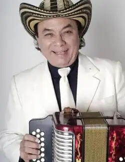 Molina holding his accordion