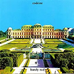 An image of the cover art for the Barely Real EP, featuring an image of Belvedere Palace and its surrounding garden area. At the top of the image in black text in lowercase is text saying "codeine" in lowercase. There is text in the same type-face at the bottom of the image in lower case saying "barely real".