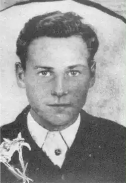 Black and white portrait photograph of Schink looking toward the viewer with a slight smile.