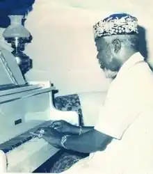 Benson playing the piano